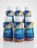 Multiple bottles of Ensure Nutrivor on a white background
