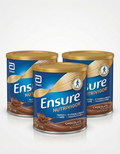 Three cans of Ensure Nutrivor protein supplement on a white background